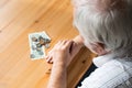 Poor senior closeup at home sit problems with money no food alone and sad Royalty Free Stock Photo