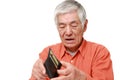 Poor senior Japanese man looking at his own empty wallet Royalty Free Stock Photo