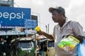 Poor senoir man selling bubble blower on the street in Colombo town