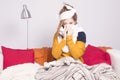 Poor sick woman, blowing her nose. Royalty Free Stock Photo