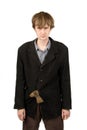 Poor student with axe in the pocket of his suit Royalty Free Stock Photo