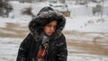 Poor Syrian Refugee Girl in a Refuge Camp at time of snow storm