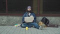 Poor unemployed man begging in street