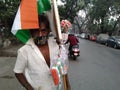Poor Vendor selling indian flags on roads