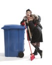 Poor woman near trash can Royalty Free Stock Photo