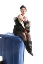 Poor woman near trash can Royalty Free Stock Photo