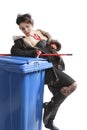 Poor woman near trash can Royalty Free Stock Photo