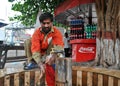 Poor worker washes his cloths at station.