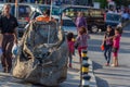 Poor young children collecting garbage