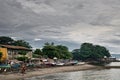 A Asian fishing village scene cloudy sky.