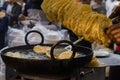 poori or puri or luchi being fried in hot steaming oil.traditional indian breakfast snack Royalty Free Stock Photo