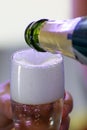 Pooring in a glass of champagne Royalty Free Stock Photo