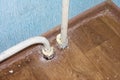 Poorly executed apartment repairs. Fragment of heating pipe. Royalty Free Stock Photo