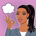 Pop art african american business woman in suit smiling and showing Ok sign with speech bubble for your message