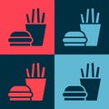 Pop art Burger and french fries in carton package box icon isolated on color background. Hamburger, cheeseburger Royalty Free Stock Photo