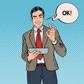 Pop Art Businessman with Tablet Gesturing OK and Winking Royalty Free Stock Photo