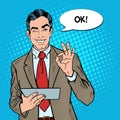 Pop Art Businessman with Tablet Gesturing OK and Winking Royalty Free Stock Photo