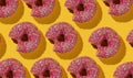 Pop art collage of bitten glazed donuts on a yellow background. Food background