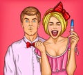 Pop art excited young woman with a positive pregnancy test and her surprised husband Royalty Free Stock Photo