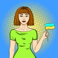 Pop art Happy young girl with the Ukrainian flag, looking at the camera. Comic style imitation Royalty Free Stock Photo