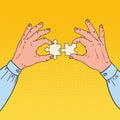 Pop Art Male Hands Holding Two Puzzle Pieces. Business Solution Concept