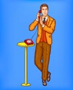 Pop art man talking on a retro phone and covering a microphone with his hand Royalty Free Stock Photo