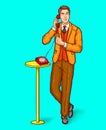 Pop art man talking on a retro phone and shows the thumbs up Royalty Free Stock Photo