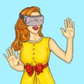 Pop art pretty young woman uses a virtual reality glasses