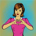 Pop art retro style woman showing heart hand sign. Comic drawn design vector illustration Royalty Free Stock Photo