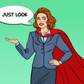 Pop Art Smiling Super Businesswoman in Red Cape Pointing on Copy Space. Presentation Royalty Free Stock Photo