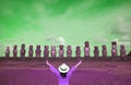 Pop art style green and purple colored happy female visitor in front of huge Moai of Ahu Tongariki, Easter Island, Chile Royalty Free Stock Photo