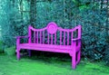 Pop Art Style Vivid Pink Wooden Bench in Turquoise Blue Colored Garden Royalty Free Stock Photo