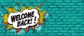 Pop art style Welcome Back on turquoise brick wall Royalty Free Stock Photo