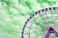 Pop Art Styled Purple Ferris Wheel Against Green Cloudy Sky