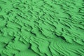 Pop art surreal style shamrock green colored unique desert sand ripple patterns for background Royalty Free Stock Photo