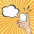 Pop art woman hand holding smart phone with speech bubble for text, telephone call concept in comic style Royalty Free Stock Photo