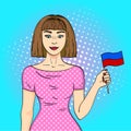 Pop art young beautiful girl holding a flag of the Republic of Haiti. Comic book style imitation. Vintage retro style