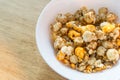 Pop corn on white bowl on wood background