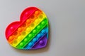 Pop it, A relaxing rainbow-colored toy for Tapping heart-shaped bubbles with your fingers Royalty Free Stock Photo