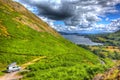 Pop top campervan The Lake District UK with view of british countryside in HDR Royalty Free Stock Photo