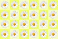 popart with twenty-four daisy blossoms on yellow colored background