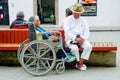 POPAYAN, COLOMBIA - FEBRUARY 06, 2018: Outdoor view of unidentified people in the streets, woman in wheel chair and man