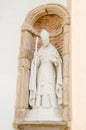 POPAYAN, COLOMBIA - MARCH 31, 2018: Outdoor view of stoned white statue of pope located in a wall or colum of a church Royalty Free Stock Photo