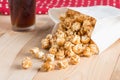 Popcorn in bag and coke on table. Royalty Free Stock Photo