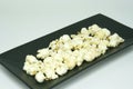 Popcorn on black dish