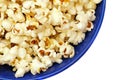 Popcorn in a blue plate isolated closeup Royalty Free Stock Photo