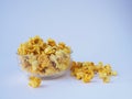 Popcorn in Glass cupon white background Royalty Free Stock Photo