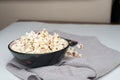 Popcorn in bowl on white background