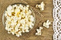 Popcorn in bowl on wooden table Royalty Free Stock Photo