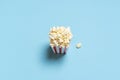 Popcorn box top view. Popcorn box isolated on a blue background